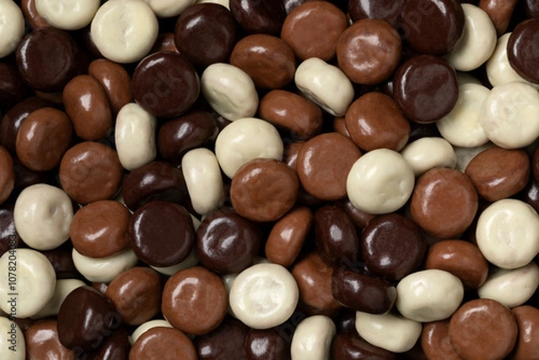 Fototapeta Variation of chocolate covered traditional Dutch kruidnoten close up full frame as background