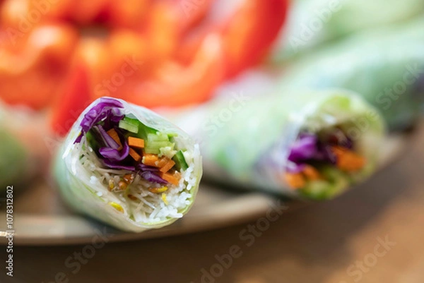 Fototapeta Close up of a colorful and fresh vegetable Spring rolls, an appetizer commonly found in Chinese and Southeast Asian cuisines