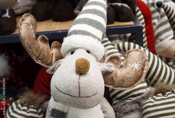 Obraz Cute soft toy Christmas deer in the store close-up.