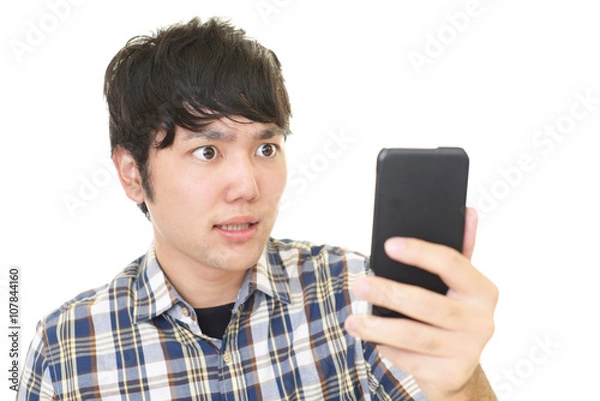 Fototapeta 驚いた表情の大学生