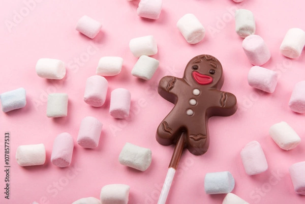 Obraz Chocolate man on pink background with marshmallows , sweet Christmas cookies, top view