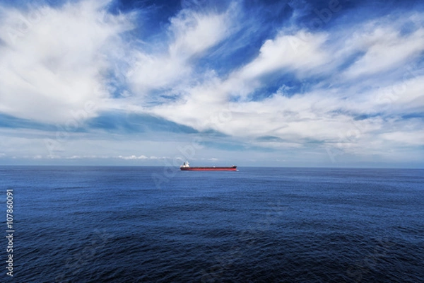 Obraz Cargo ship underway in the sea.