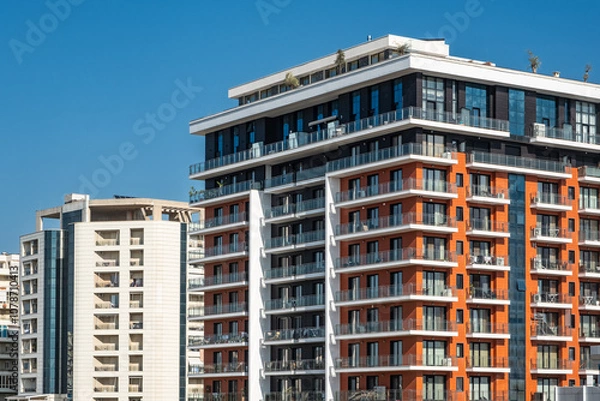 Fototapeta New modern architectural building house. Multistoried modern, new living block of flats