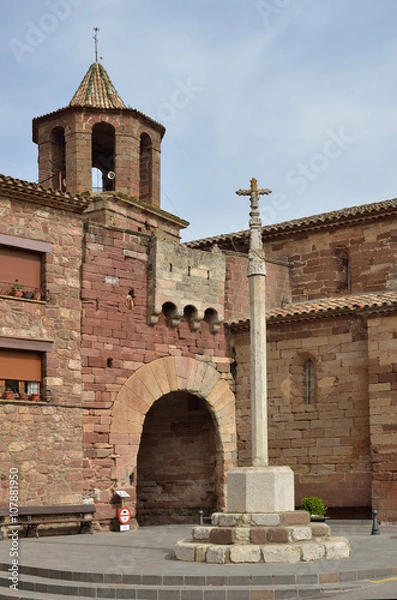 Fototapeta The boundary cross and the ancient gate in the Spanish town Prades