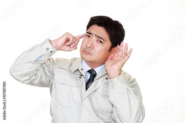 Fototapeta 耳に手を当てる作業員