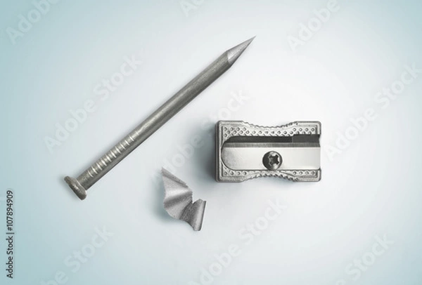 Fototapeta Nail and sharpener. Creative concept