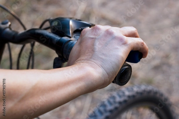 Fototapeta hands on handlebar bicycle on nature background