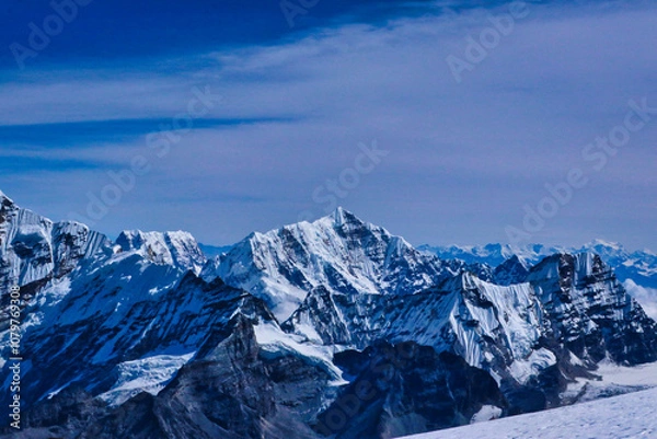 Fototapeta Tutse,6758 m in the center of frame along with the Kanchenjunga himalayas in the far background in this south east view from Mera Peak central summit,6461 m,Mera Peak Expedition,Nepal 