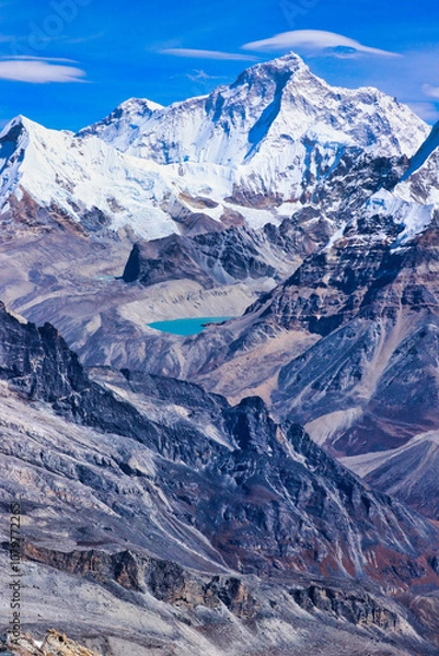 Fototapeta Vertical photo of stunning Mount Makalu,8485 m,5th highest mountain in the world with an azure blue glacial lake at its base viewed from Mera Peak,Nepal 