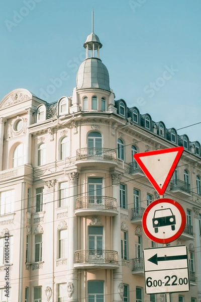 Obraz Road signs on the background of the former Savoy Hotel in Vinnytsia, Ukraine