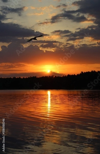 Obraz Orange sunset over the lake, beautiful abstract nature background, landscape, bright sky, spring warm evening, bright colors of spring, water, reflection, sun rays, fiery sunset, inspiration, horizon