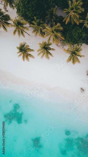 Fototapeta A relaxing beach wallpaper with soft white sand, clear turquoise water, and palm trees swaying in the breeze, bathed in warm golden light.