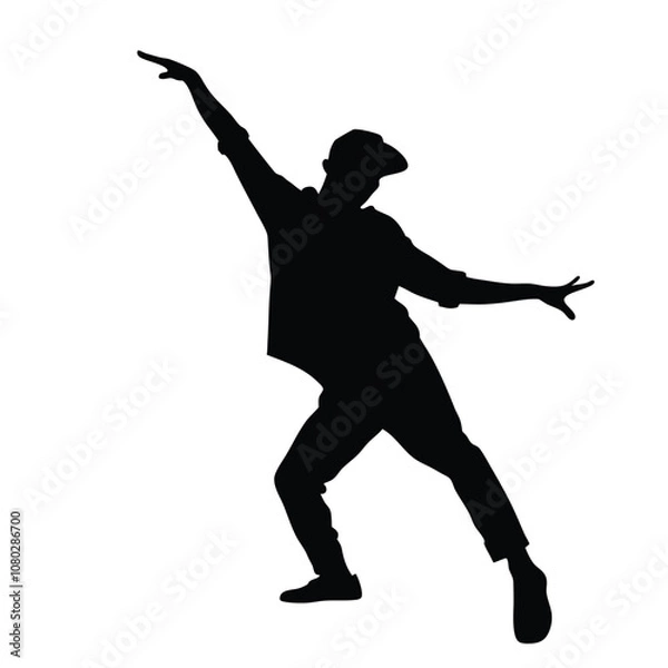 Obraz A man is dancing in the air. He is wearing a hat. The man is wearing a black shirt