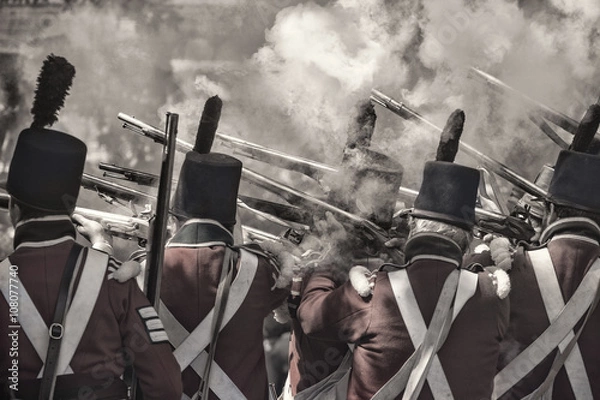Fototapeta soldiers firing the guns re-enacting the war in 1812