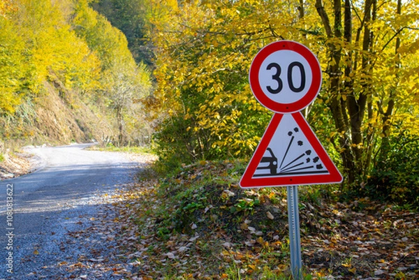 Obraz Loose gravel road sign. Speed ​​limit sign.