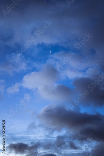 Obraz Blue sky with clouds and waning moon