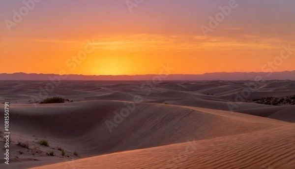 Fototapeta Sunset Over the Vast Desert With Rolling Sand Dunes Glowing Golden Under the Fading Light, While the Sky Transitions From Orange to Deep Purple in the Distance