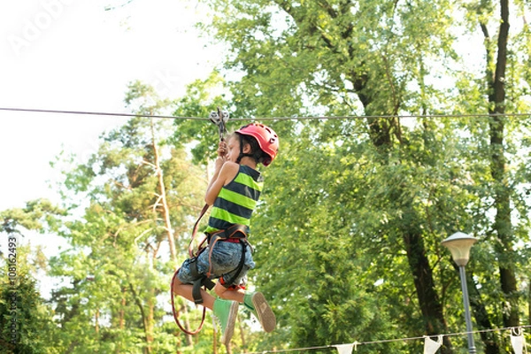 Fototapeta Six years boy on rope-way in the forest