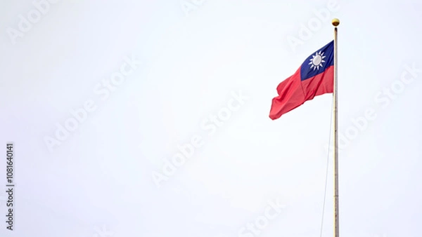 Fototapeta Taiwan flag waving high on tall pole against sky with empty copy space for text
