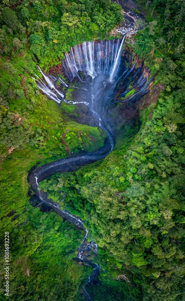 Fototapeta Aerial top view from above of Tumpak Sewu ,also known as Coban Sewu, 120m high waterfall in Malang regency, East Java, Indonesia