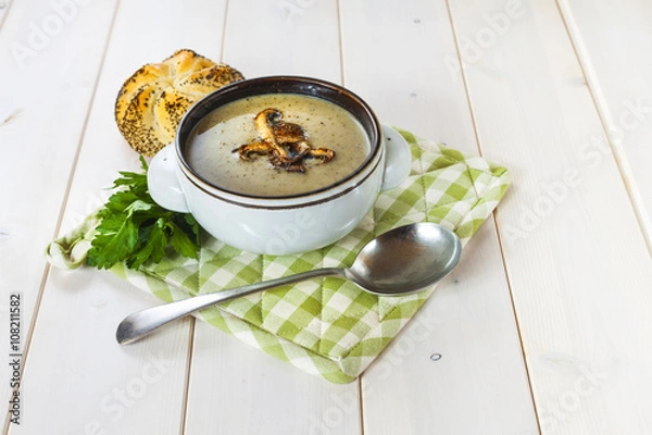 Obraz Mushroom soup with a bread roll and parsley