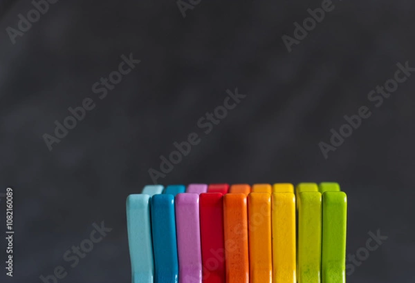 Obraz wooden blocks rainbow colored gray background