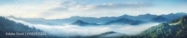 Obraz An ethereal view of a foggy jungle landscape with mist swirling among the mountains, creating a mysterious and tranquil natural tapestry.