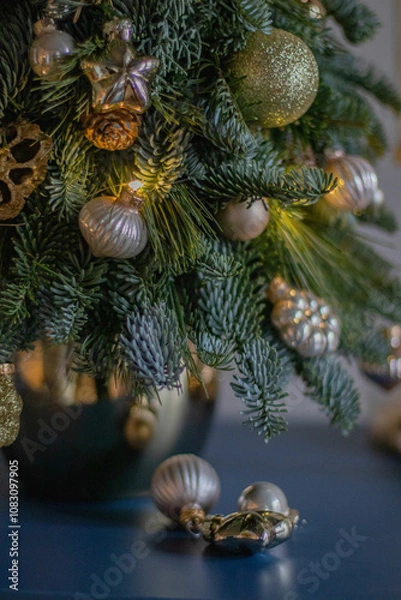 Obraz A gift version of the small Christmas tree. Natural nobilis. Gold balls. Christmas tree Handmade. New year. Ideal decoration article for office and home tables.