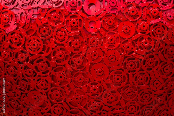Obraz cogs gears in motion red background team work connected technology