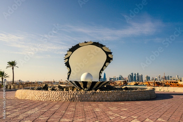 Obraz Pearl statue fountain and tall buildings behind it in Souq Waqif district of Doha, Qatar