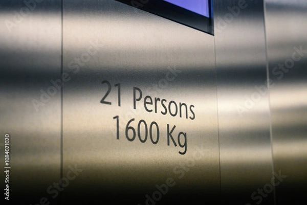 Fototapeta Information text indicating the weight and person capacity of the elevator