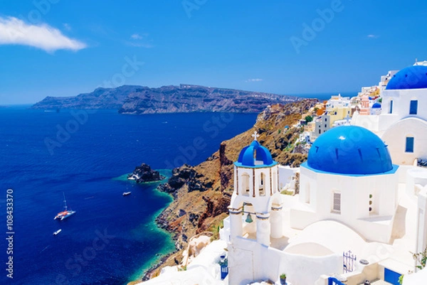Obraz White architecture and churches with blue domes, Oia, Santorini, Greece