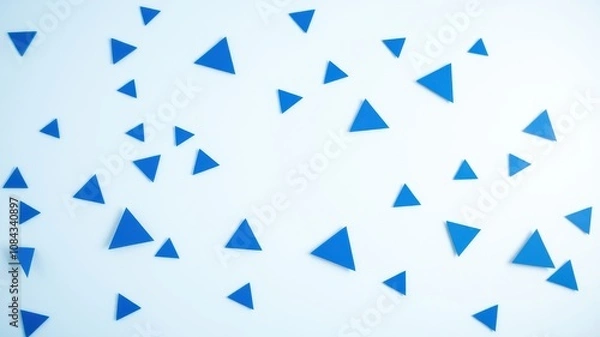 Fototapeta A minimalist composition featuring a scattered array of cobalt blue triangles against a crisp white background, creating a dynamic and eye-catching visual.