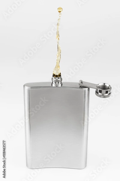 Obraz Liquor coming out of a liquor flask, non gravity