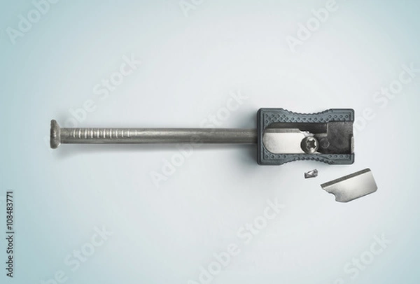 Fototapeta Nail and a broken sharpener. Creative concept. Safety, destruction. Top view
