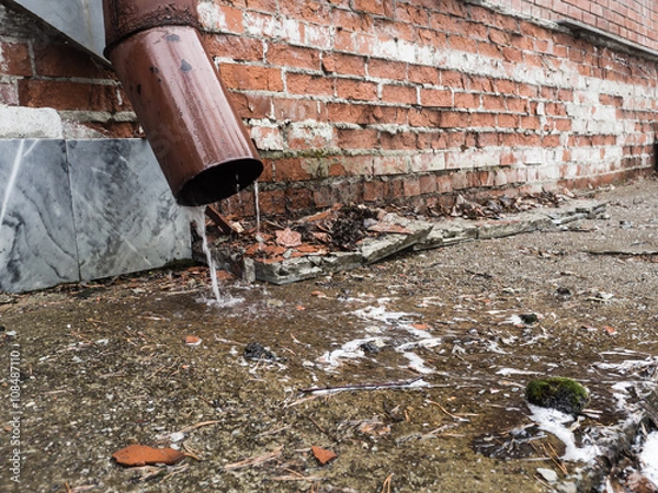 Obraz Rain water flowing from drain pipe closeup