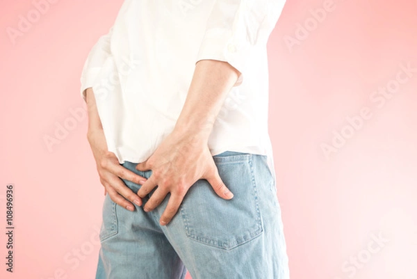 Obraz お尻を押さえる男性