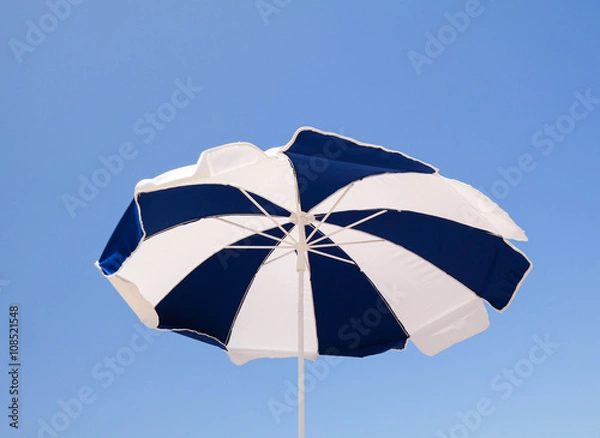 Obraz Low angle view of beach umbrella
