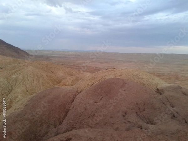 Fototapeta A striking desert rock formation under a clear blue sky, highlighting geological wonder.