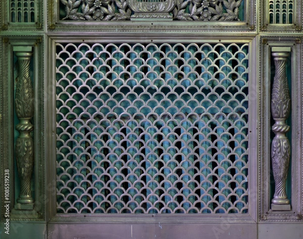 Fototapeta A beautiful metal (copper) grille covers two rows of heating batteries