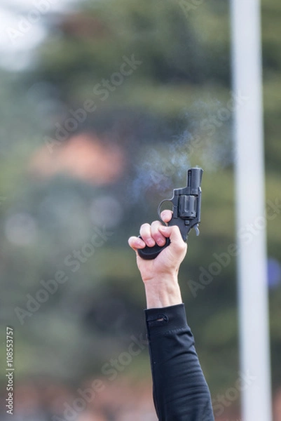 Fototapeta athletics gun firing in the air