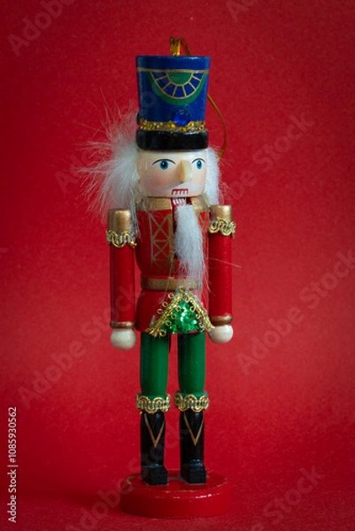 Fototapeta Nutcracker toy on redbackground