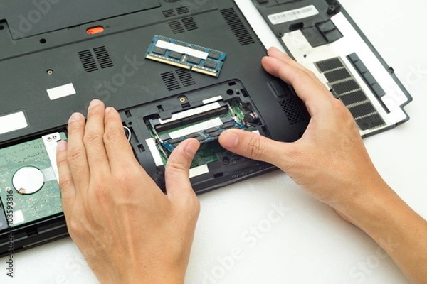 Fototapeta Hand push RAM is changing for Laptop computer,Repair computer concept.