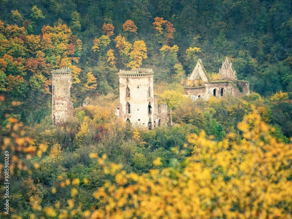 Obraz telephoto view to ruins of medieval castle and church in autumn forest