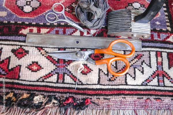 Obraz Tools for the restoration of the old of worn woolen carpet