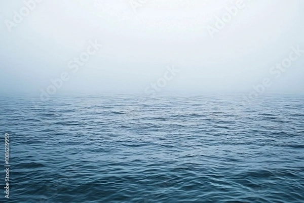 Fototapeta Misty Calm Waters: A Serene Ocean View Shrouded in Fog