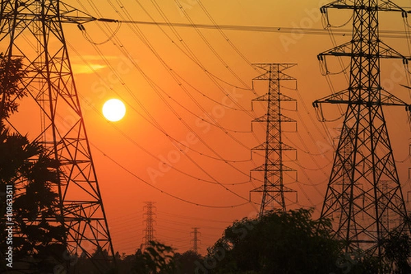 Fototapeta 送電線の鉄塔と夕焼け