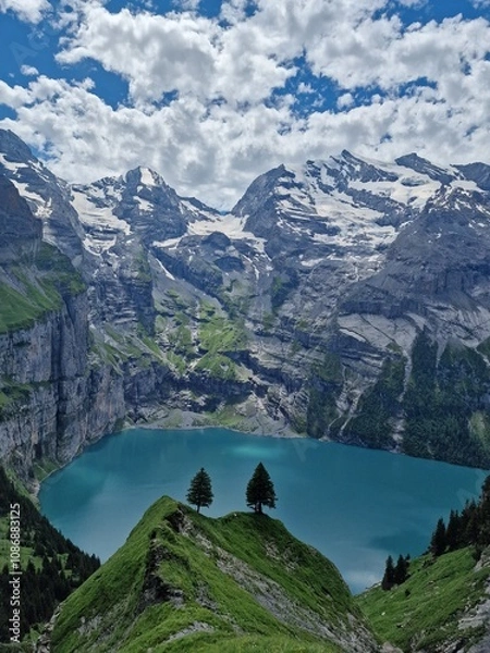 Obraz Two pine trees above the turquoise lake surrounded by mesmerising mountains and glaciers