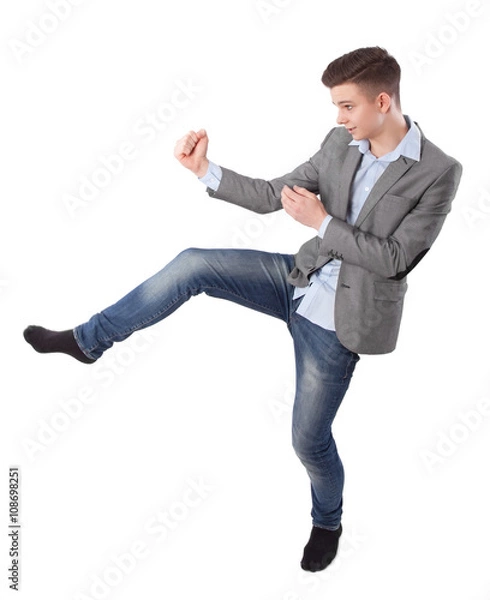 Fototapeta boy does karate kick