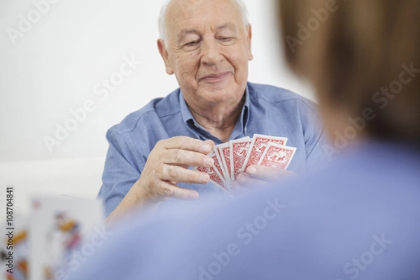 Fototapeta senior couple playing cards stock image